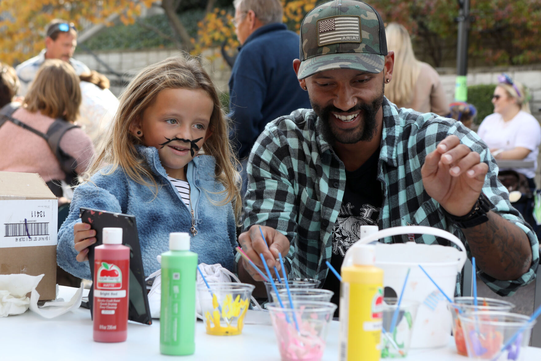 Isaac Purnell does Alivia's face paint